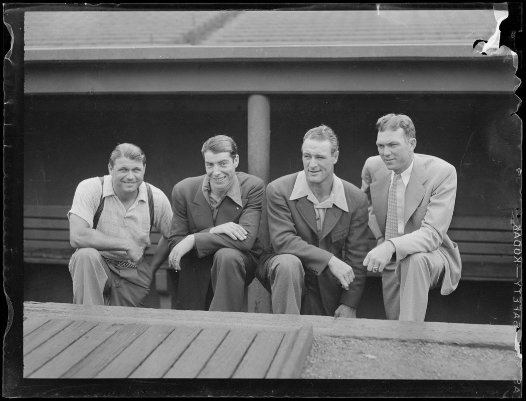 Foxx, DiMaggio, Gehrig and other man in Fenway dugout