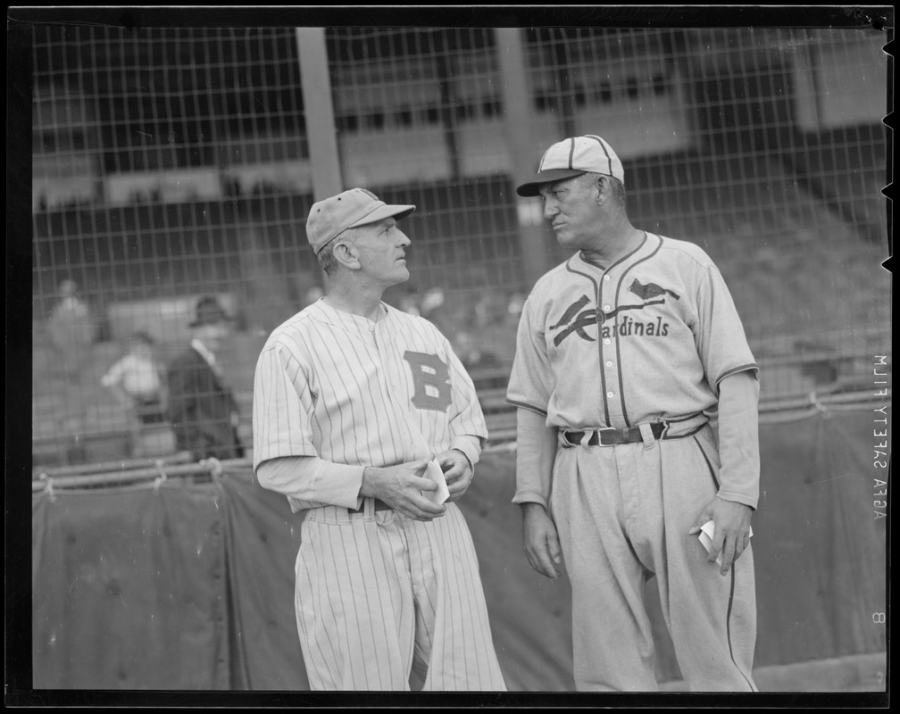 Bees manager Casey Stengel talks with his Cardinal counterpart