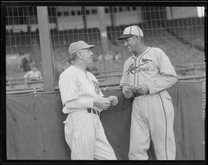 Bees manager Casey Stengel talks with his Cardinal counterpart