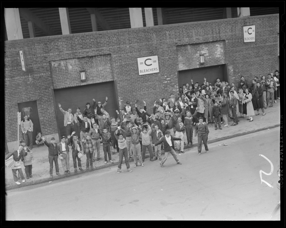 Kids crowding outside the bleachers entrance on Opening Day at Fenway