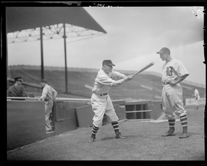 Casey Stengel instructs one of his players on the finer points of hitting