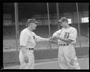 Casey Stengel instructs one of his players on the finer points of hitting