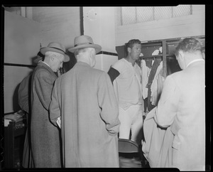 Newsmen interview Ted Williams in the locker room