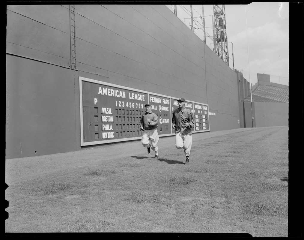 Fenway Park, Boston, MA, July 4, 1947 – Red Sox great Ted Williams in left  field with the freshly painted Green Monster behind him