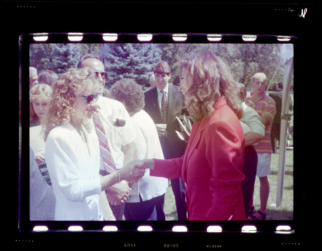 Two women shaking hands