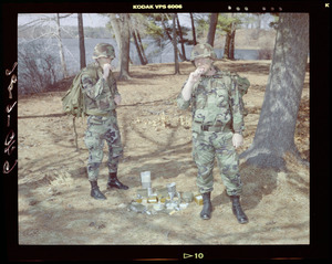 Food lab, 2 G.I. eating ration in woods