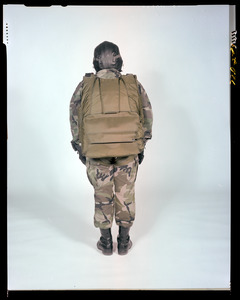 AMEL basic military free fall parachute system on jumper, back view