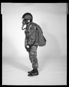 AMEL basic military free fall parachute system on jumper, side view