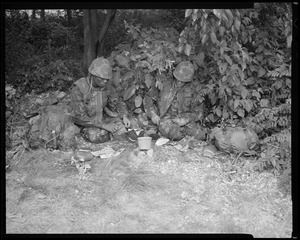 Food lab, new meal, ready to eat, out in field with G.I. opening food pack