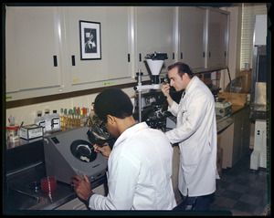 Personnel, lab shot, 2 men w/white coats