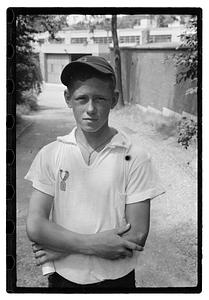A boy with an medal pinned on his shirt