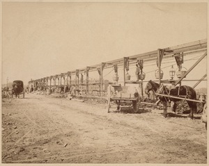 Horse and wagon near construction