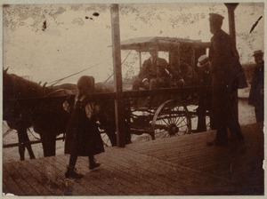 Girl in front of carriage