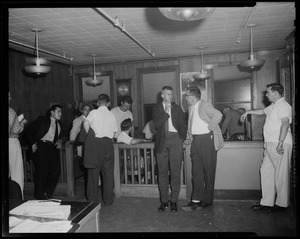 Men standing in a room