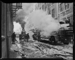 Street scene of firefighters fighting fire