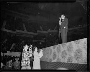 Bob Hope on stage, addressing the crowd at Boston Garden