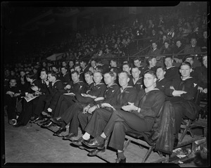 Military members in uniform, seated at Boston Garden