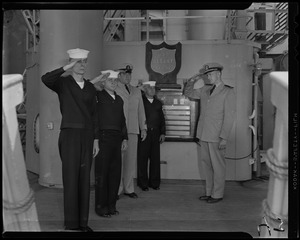 Men saluting on deck of U.S.S. Albany