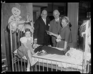 Helen Hayes presenting check to Dr. P. D. Howe, Children's Hospital president with Edward C. Donnelly, Jr., Bay State vicechairman of the March of Dimes, Nancy Locke, and Joseph Locke