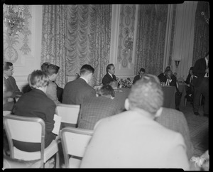 Stage right view of Governor Wallace addressing a crowd of newsmen at the Sheraton-Plaza Hotel