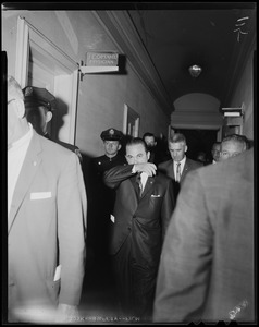 Governor Wallace walking with men and police in hallway