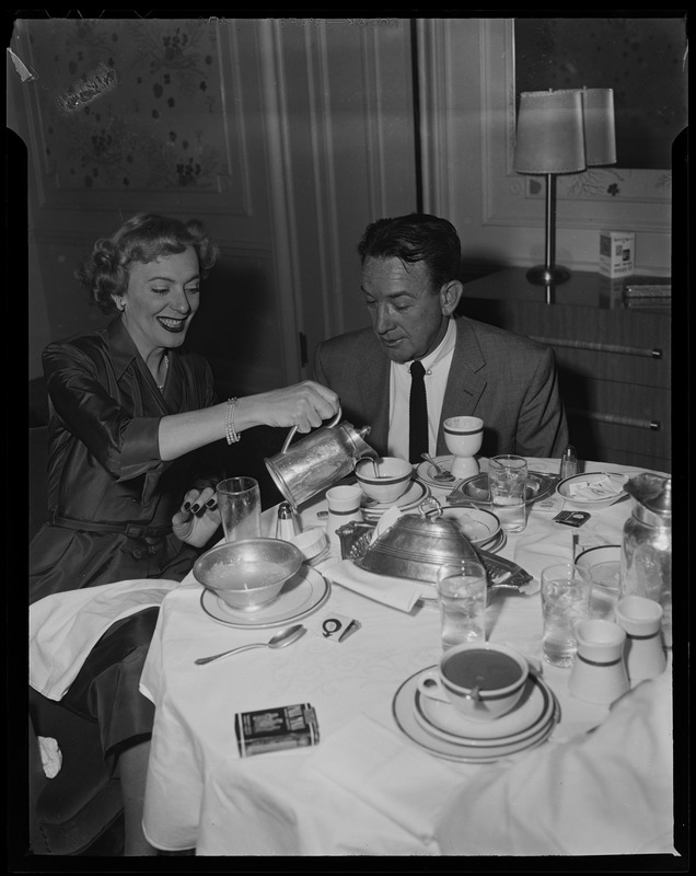 Christine Jorgenson pouring a hot beverage at a table with a man