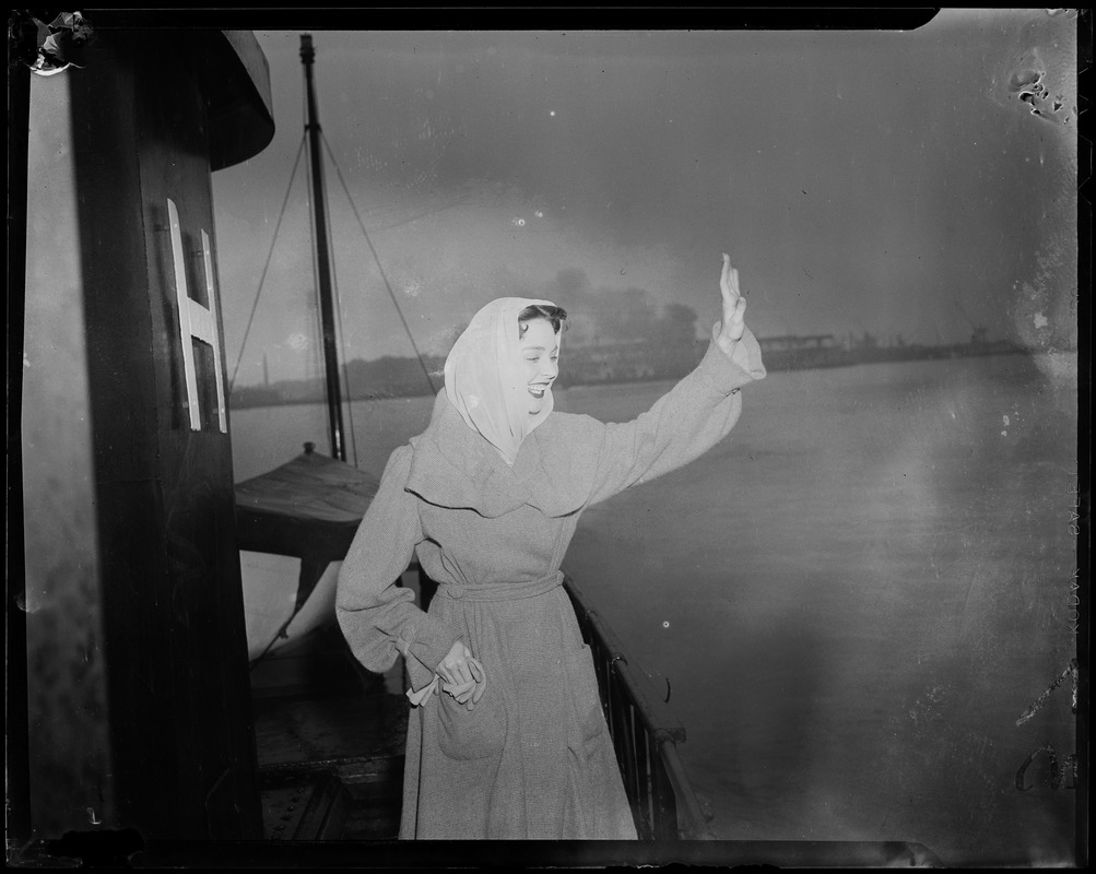 Jennifer Jones waving aboard a ship