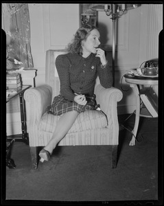 Helen Hayes sitting in a chair