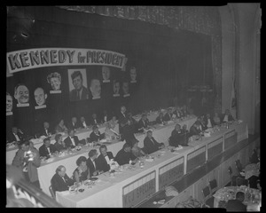 Overview of the table at the Mass. Citizens for Kennedy and Jackson Destination D.C. Dinner with Kennedy for President banner and photos, Mrs. Joseph P Kennedy and Henry M Jackson pictured