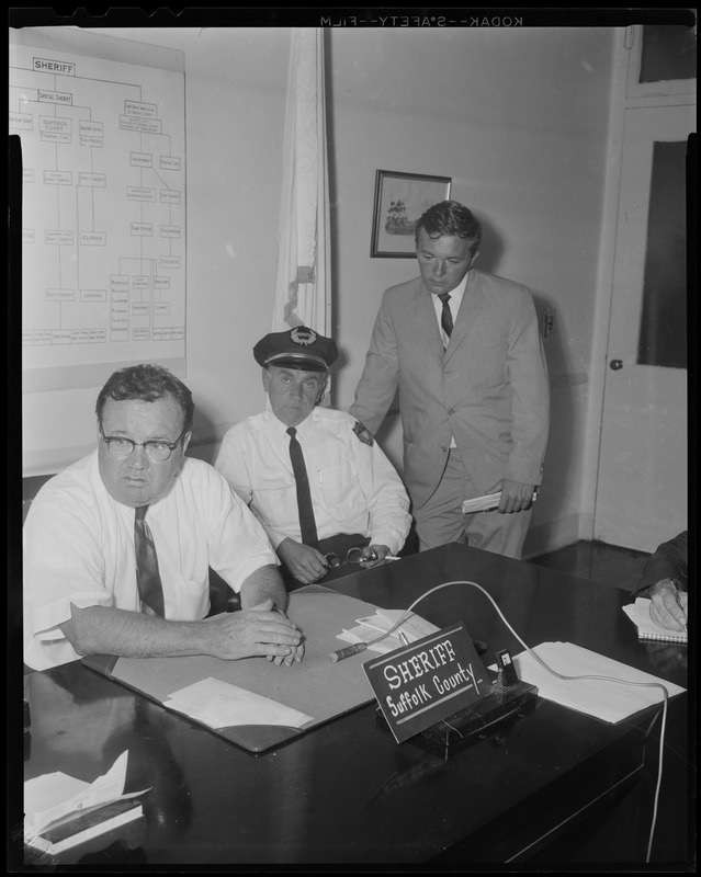 Sheriff Frederick Sullivan, guard James McDermott, and Deputy Sheriff Gregory Kelly