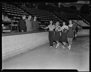Four women skating as Walter Brown and two other men look on