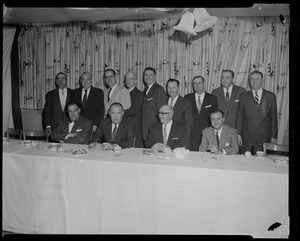 Walter Brown and twelve men, one row seated, other row standing