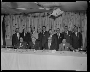 Walter Brown and twelve men, one row seated, other row standing