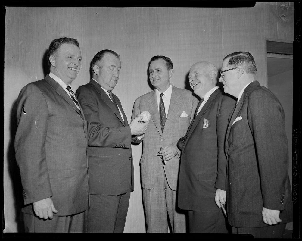 Walter Brown and another man holding autographed baseball while three ...