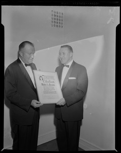 Walter Brown Pres. Boston Garden receives plaque from Melvin Ravech Pres. Assn for Retarded Children