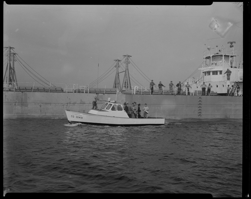 Liberian freighter Alberta with US Coast Guard boat beside it, both with men on board, anchored off Cape Cod canal, following the mutiny of the crew after Captain Gerasimos Potamianos' attempted murder of Elefehrios Metaxes