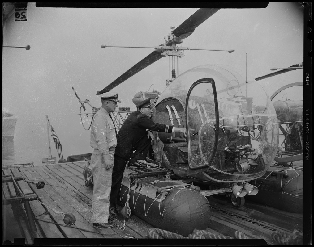 Jacobsen and Law looking at helicopter