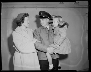 Ship personnel with wife and daughter