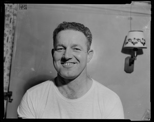 Portrait of a crew member with a lamp in the background