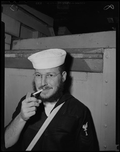 Portrait of a crew member lighting a cigarette