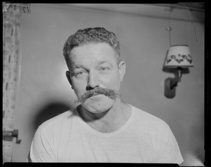 Portrait of a crew member with a mustache