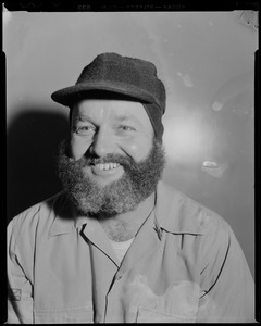 Portrait of a crew member wearing a hat