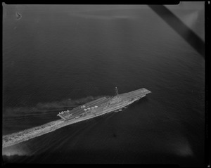 View of a ship with smoke coming off it from above