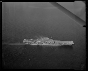 View of a ship with smoke coming off it from above