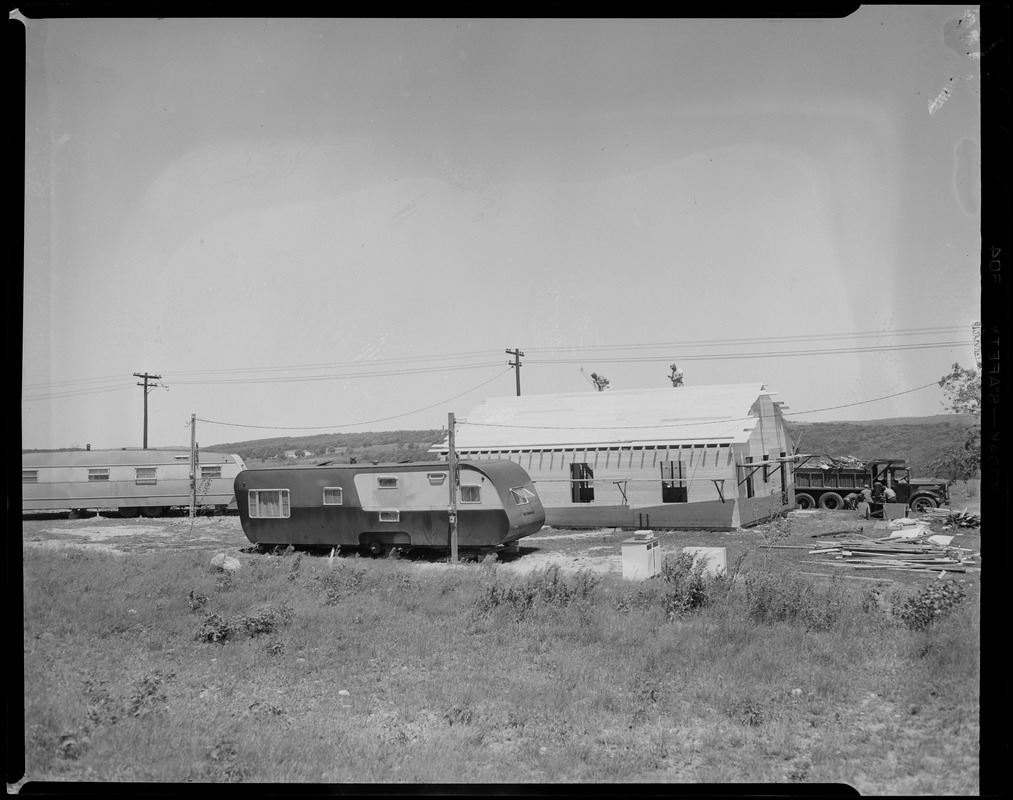 view-of-a-mobile-home-and-the-construction-of-a-building-beside-it