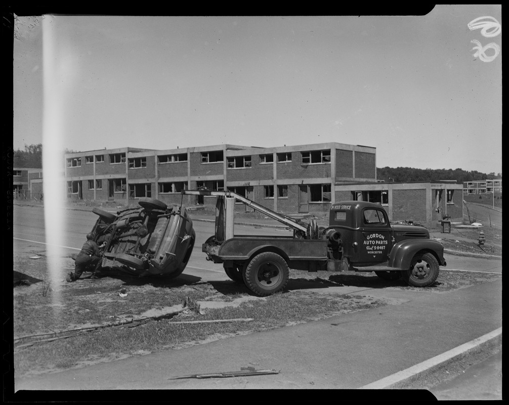 Gordon Auto Parts tow truck moving an overturned vehicle Digital