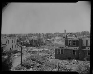 Neighborhood view of destruction, with some standing homes