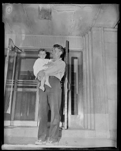Man holding a young child