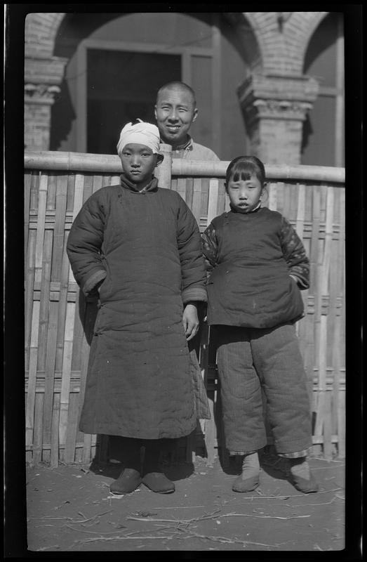 Three people at Yangtse-Poo medical and social community center