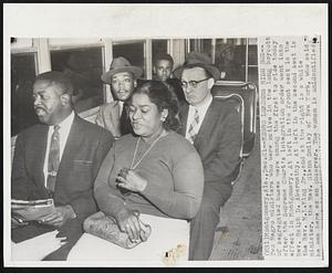 Negro Leaders Ride Bus--Two Negro ministers who were active in the long boycott of segregated buses were among the first to ride today after the Supreme Court’s integration order went into effect in Montgomery. At left in the front seat is the Rev. Ralph D. Abernathy. At the left in the second seat is the Rev. M. L. King Jr., and at the right is a white minister, the Rev. Glenn Smiley of New York, who said he was here as an observer. The woman is unidentified.